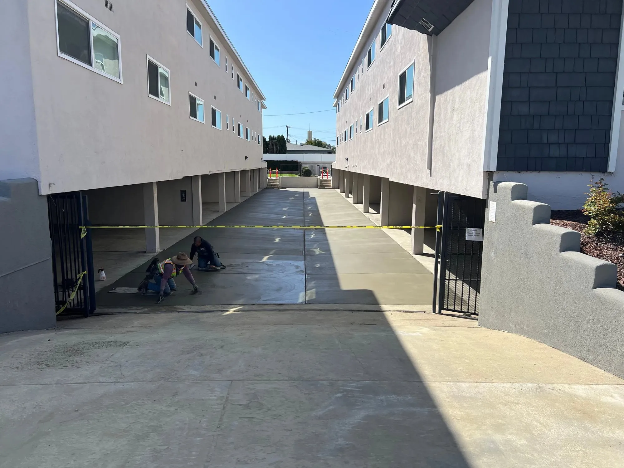New concrete driveway between two apartment buildings